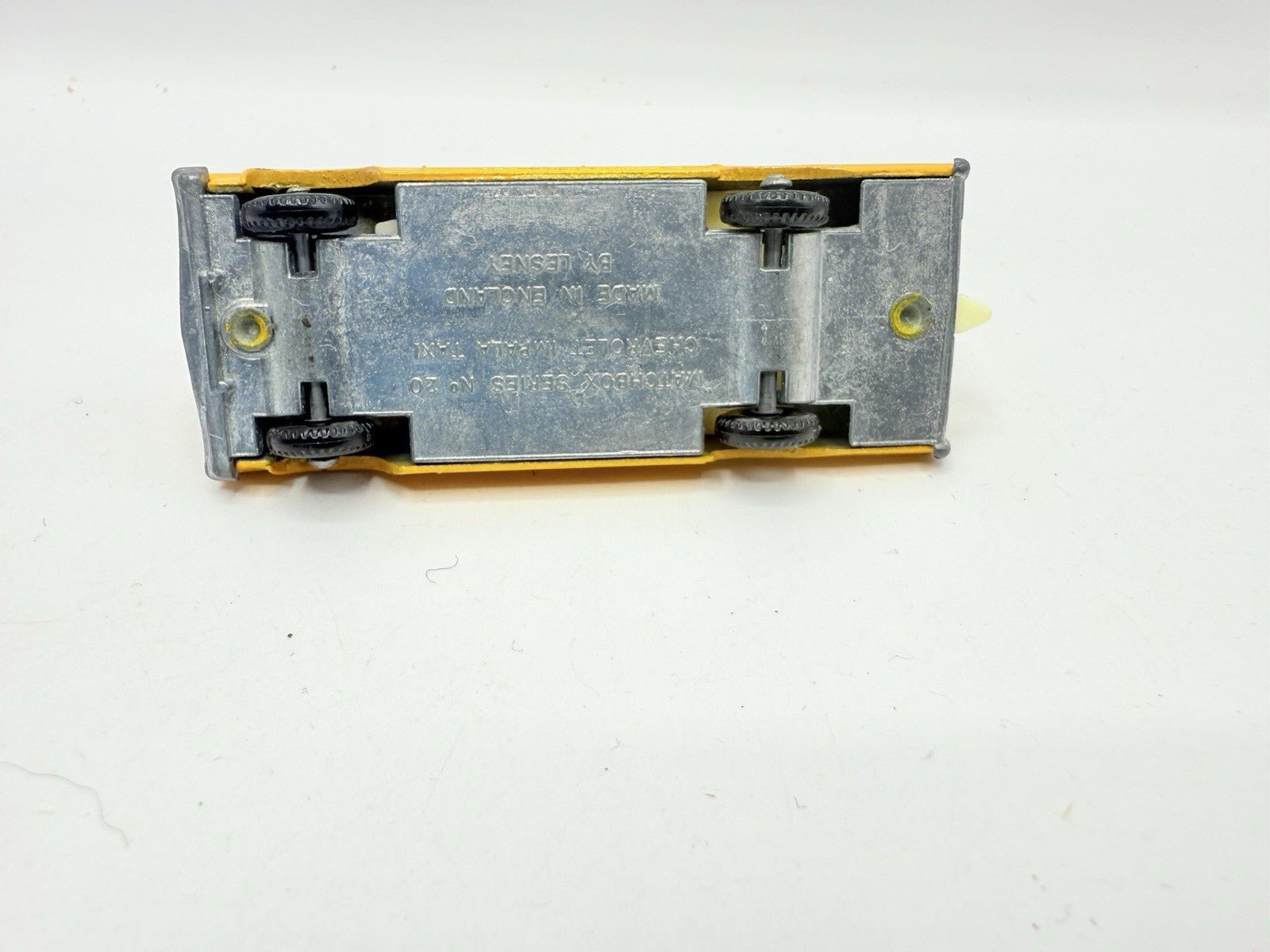 Matchbox Lesney 20c Chevrolet Impala Taxi BPW Unpainted Base - Magic Matchbox